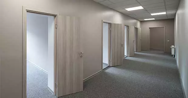 The Importance of Refinishing a Commercial Wood Door
